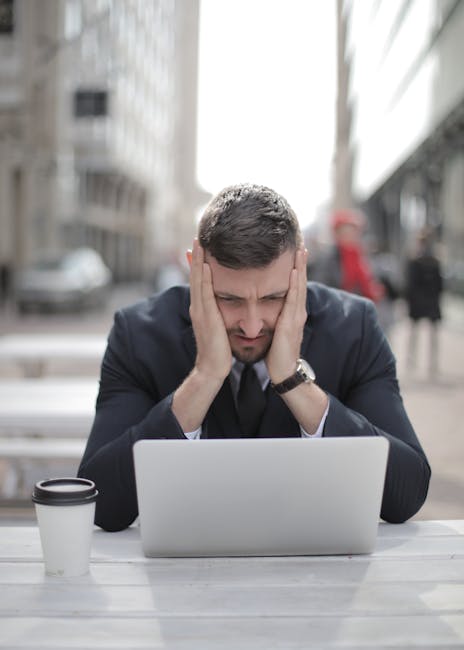 restaurant owner frustrated at computer